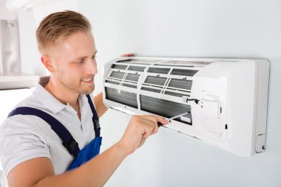 Important-Considerations-for-AC-Installation-and-Update – Copy HVAC technician cleaning and repairing a ductless mini split AC in Bullhead City, AZ